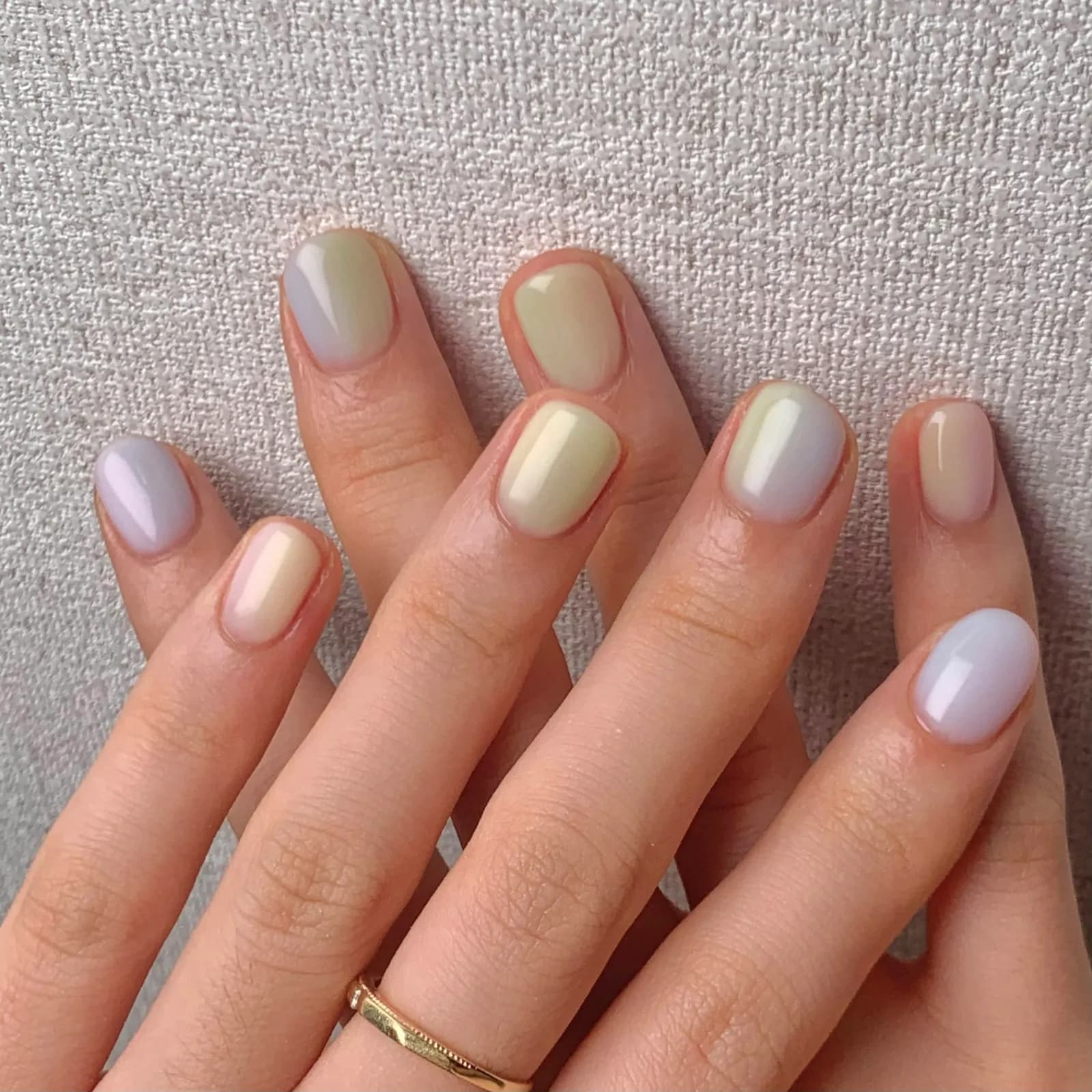 Short nails, each one a different soft pastel